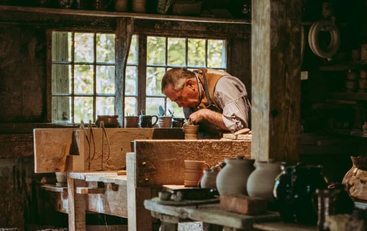 Craftsman potter at a wheel